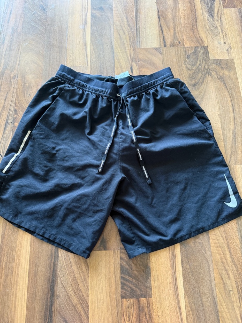 Nike Black Running Shorts with Reflective Swoosh and Stripe